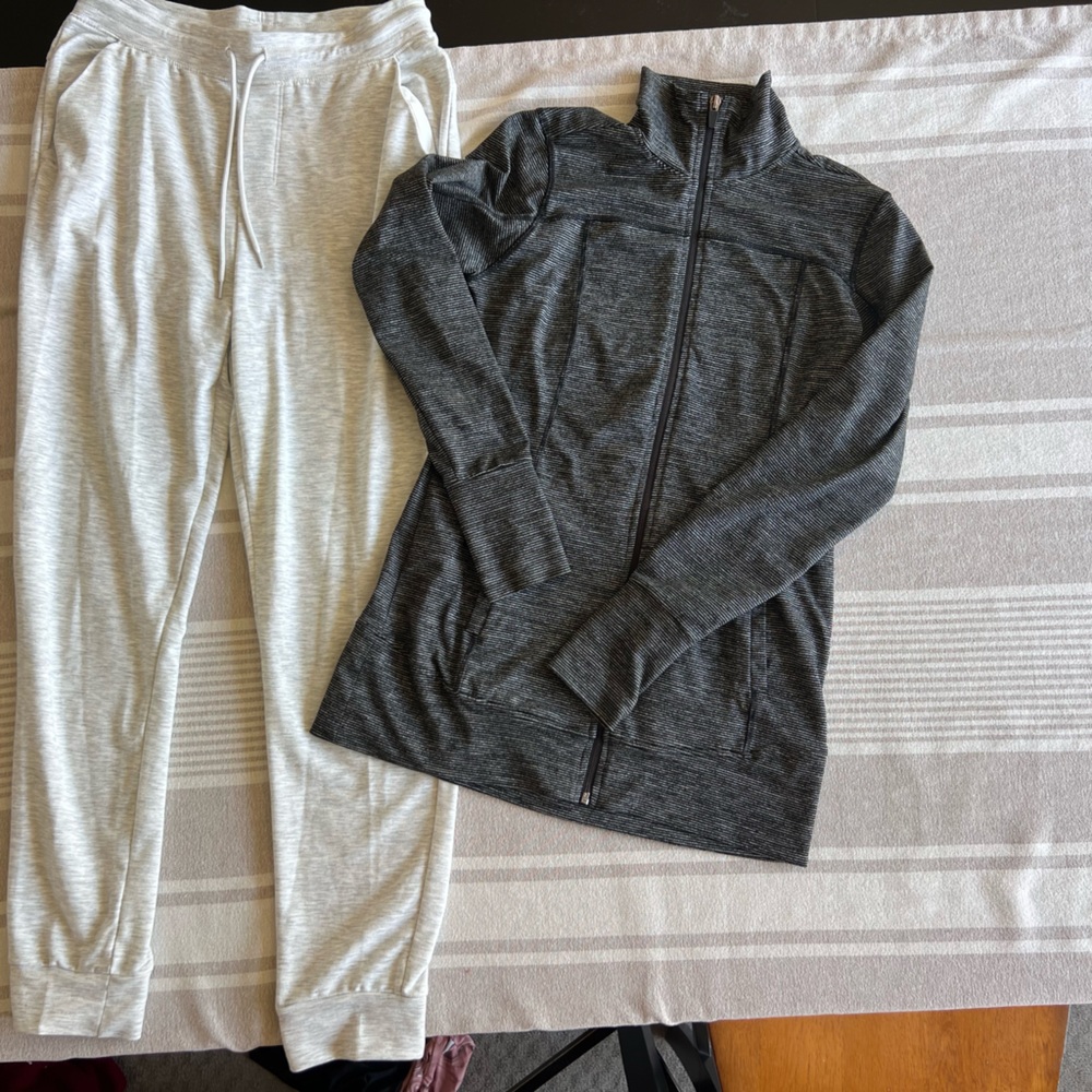 Work out jacket, very comfy and cozy. Hugs the body. ￼ sweats are breathable